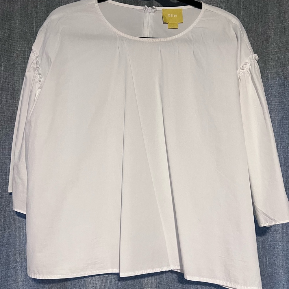 White cotton blouse with ruffle details.Maeve from Anthropologie.